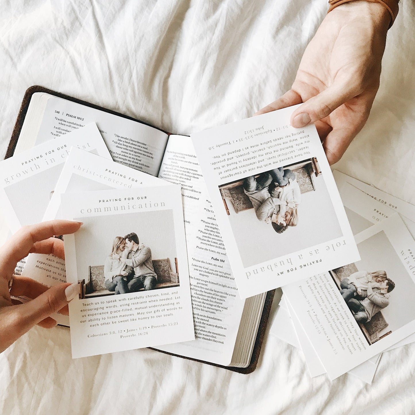A Christian couple learning to praying together as husband and wife with an open Bible for a christ-centered marriage