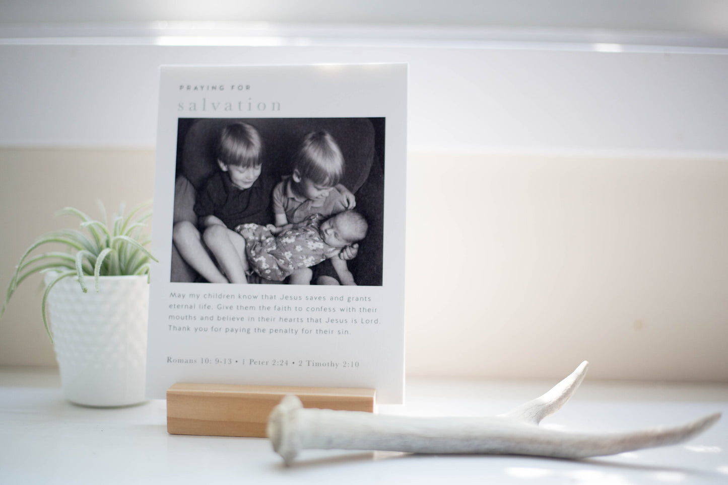 A personalized prayer on a card in a wooden display stand handmade to place in your home decor to serve as a reminder to pray for your family to the Lord God which is a great gift for moms or parents