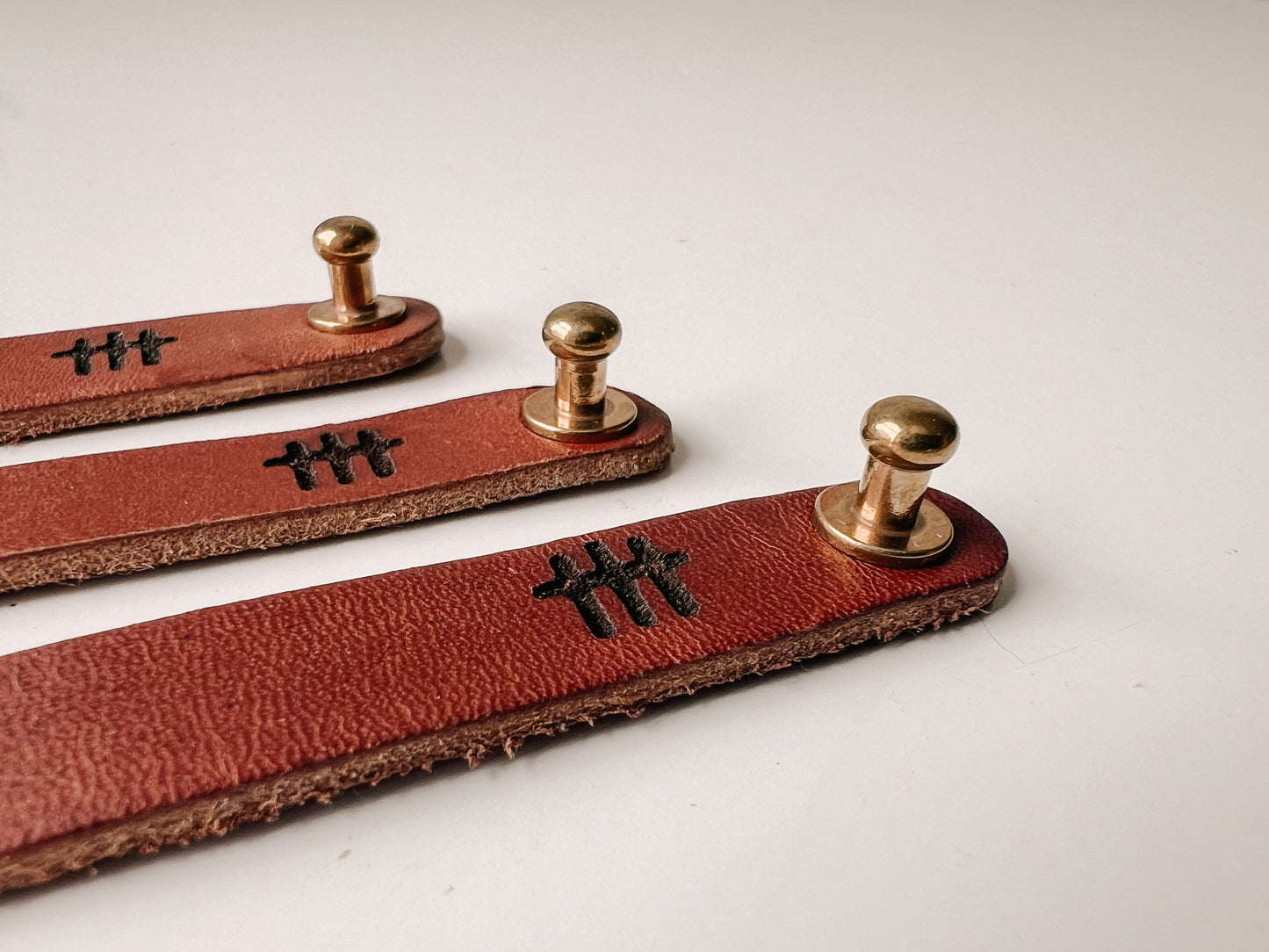 Handcrafted with American Saddle leather and made by hand, this leather bracelet with brass closure is to remind men and women to pray always.