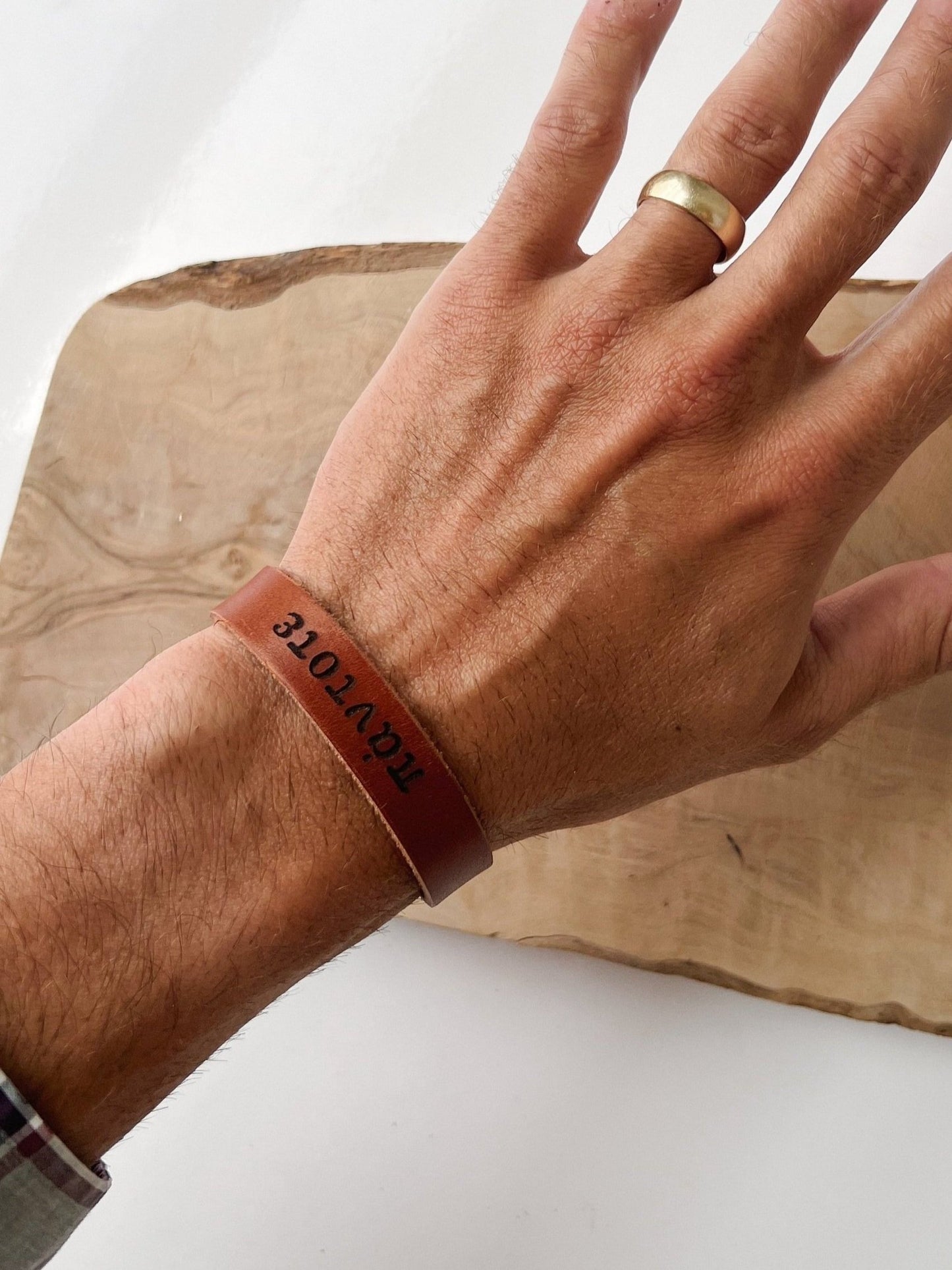 Handmade leather bracelet for men and women to remind them to pray with greek word for 'always' stamped into the leather.